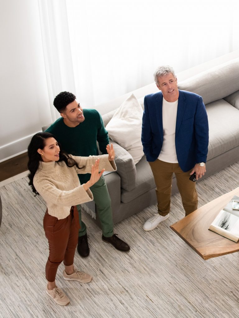 Agent with clients touring a home